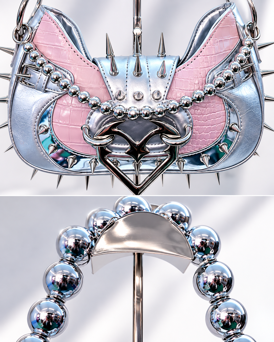 Angel Damage shoulder bag close-up showing pink croc-effect panels, metal spikes, devil heart buckle and silver bead strap