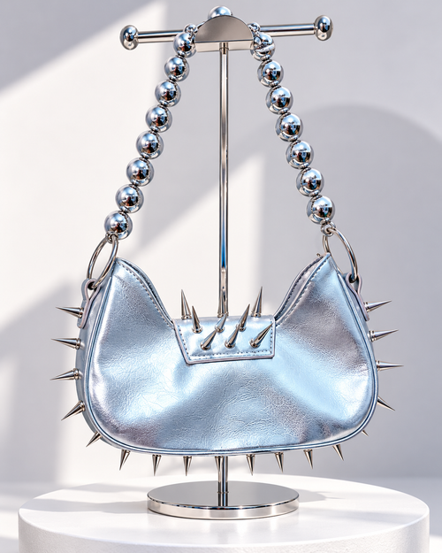 Back of Angel Damage metallic silver spiked Y2K shoulder bag with oversized silver bead strap