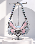 Angel Damage pink and silver spiked Y2K shoulder bag with devil heart buckle and silver bead strap